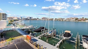 A marina with boats docked, a dock, and buildings in the background. - Waterside, Studio #21, Family Friendly, Close to Beach (Clearwater Beach)