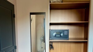 A room with a wooden wardrobe, a mirror, and a fan. - Alpilles-side apartment with terrace in Saint-Remy-de-Provence (Saint-Rémy-de-Provence)