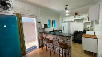 Family House, 3 Bedrooms | Private kitchen | Full-size fridge, microwave, blender, cleaning supplies