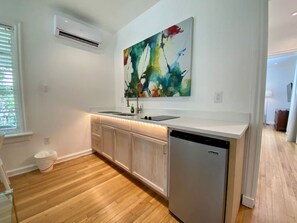 Fridge, microwave, stovetop, coffee/tea maker