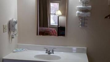 Combined shower/tub, hair dryer, towels, soap