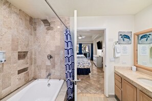Bathtub, hair dryer, towels, soap