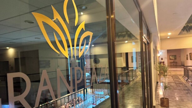 A hotel entrance with a glass door featuring the name 'RANPA HOTEL' and a stylized logo. - Gran Plaza Hotel Centro Historico (Iguala de la Independencia)