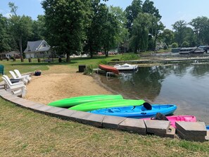 Enjoy serene lakeside views and easy access to kayaks and a dock.