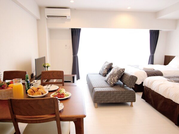 Standard Twin Room | Living area | 30-inch flat-screen TV with digital channels, TV - Sunset Resort Mihama (Chatan)