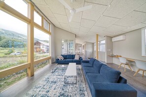 Luxury Chalet, 5 Bedrooms, Kitchen, Mountain View | Living area | Flat-screen TV, heated floors, streaming services -  Echo Rocks (Hakuba)