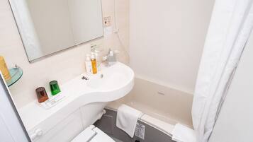 Combined shower/tub, hair dryer, slippers, bidet