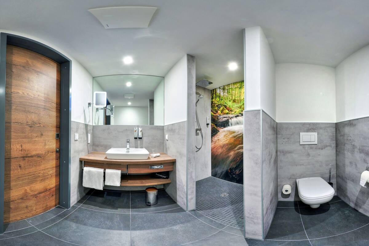 junior double room | bathroom | shower, rainfall showerhead, free toiletries, hair dryer