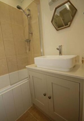 Bathtub, hair dryer, towels, soap
