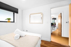 1 bedroom, desk, iron/ironing board, travel crib