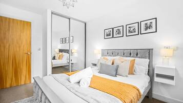 1 bedroom, desk, iron/ironing board, travel crib