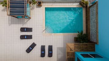 Outdoor pool, open 7:00 AM to 7:00 PM, pool loungers