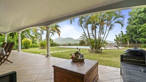 A covered patio with a view of a swimming pool, outdoor furniture, and a barbecue grill. - Nature Paradise - Four Bedroom Villa, Sleeps 8 (Rivière-Pilote)