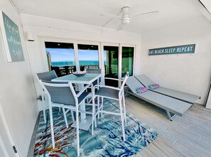 Outdoor dining - Top Floor Beachfront & Sunset Views! Walk to Everything! Smart TVs + Workspace! (Fort Myers Beach)