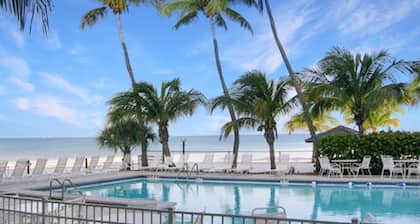 Top Floor Beachfront & Sunset Views! Renovated! WIFI, Smart TV's + Work Space!