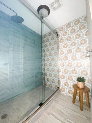 Shower, hair dryer, towels, soap