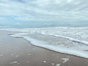 On the beach, sun loungers, beach towels