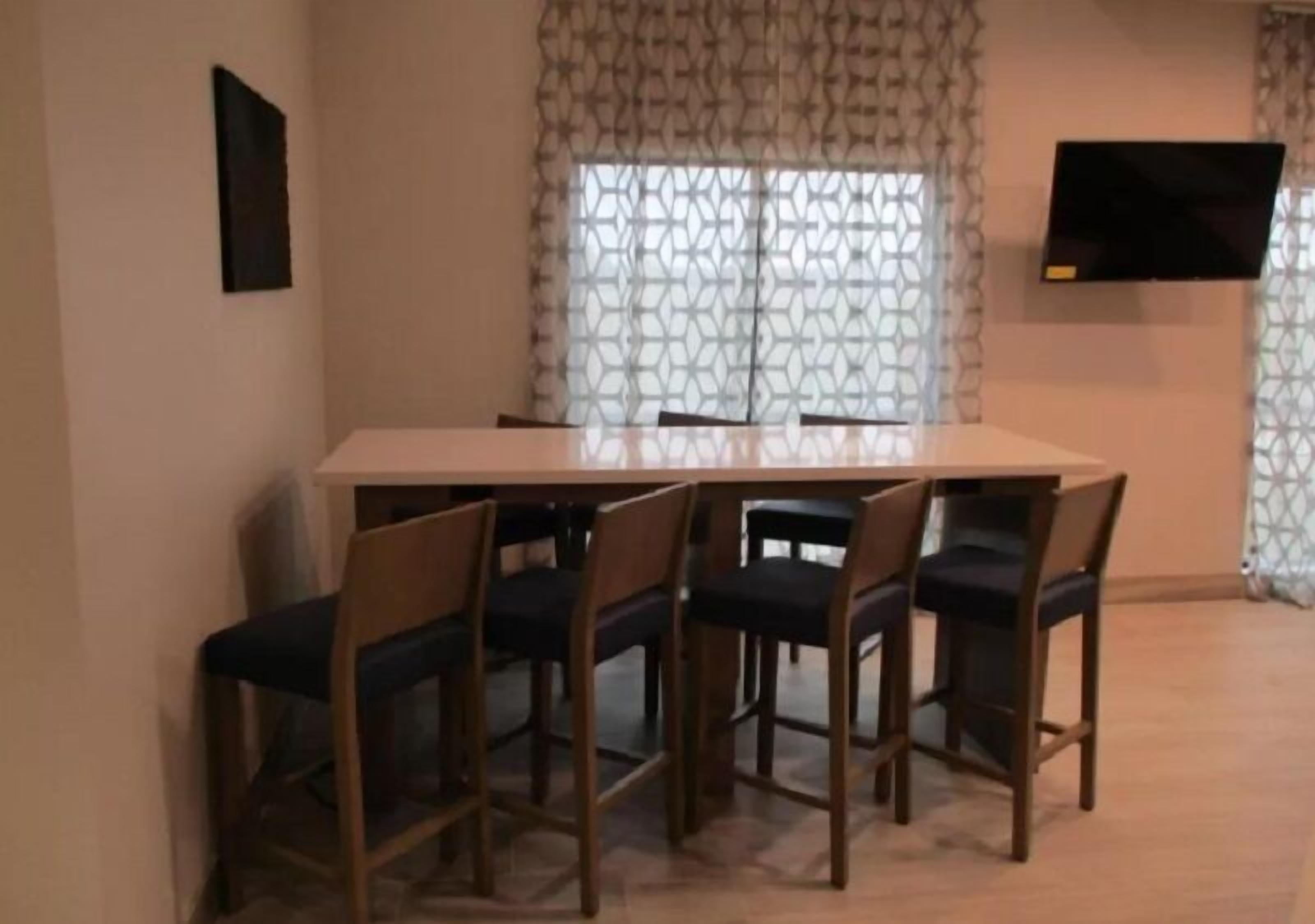 Desk, laptop workspace, iron/ironing board, free cribs/infant beds