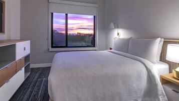 Suite, 1 Bedroom | Desk, blackout drapes, iron/ironing board, free WiFi