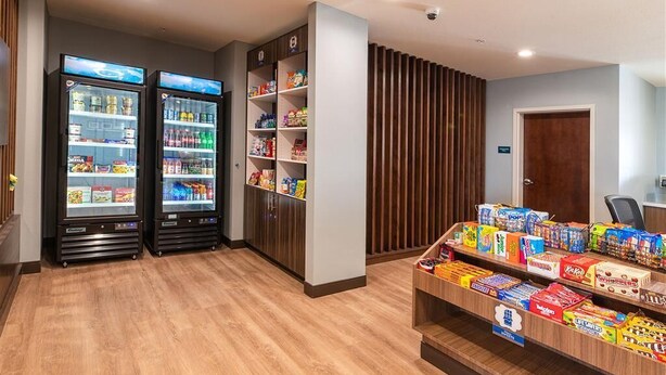 A vending area with two refrigerated machines and a snack display. - MainStay Suites Carlsbad South (Carlsbad)