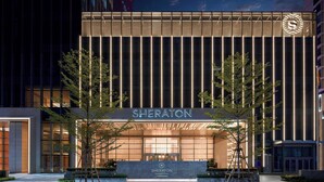 A Sheraton hotel entrance with a modern facade, large glass windows, and a prominent logo. - Sheraton Guangzhou Panyu (Guangzhou)