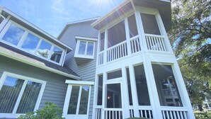 A two-story house with a balcony on the upper floor. - Beautiful Furnishings! Great Location! (Myrtle Beach)