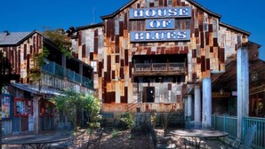 A building with a sign reading "HOUSE OF BLUES" and a balcony. - Oceanview Villa With NEW Furniture! (Myrtle Beach)