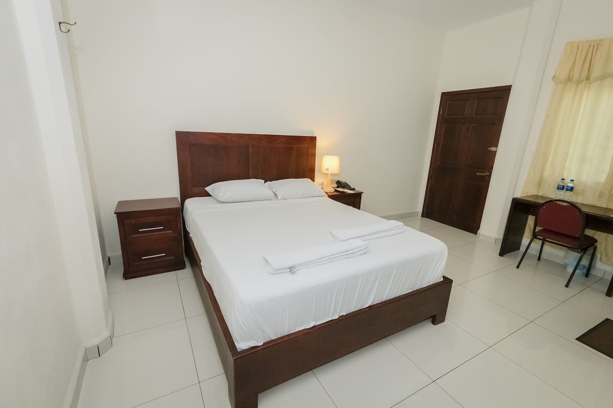 Habitación individual estándar | Ropa de cama de alta calidad y edredón