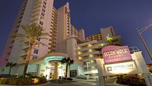 A hotel with a prominent sign for Oceanwalk Resort, featuring a modern design with multiple floors and balconies. - Ocean Front Two Bedroom Lock Off, Daytona Beach 2056760 (Daytona Beach)