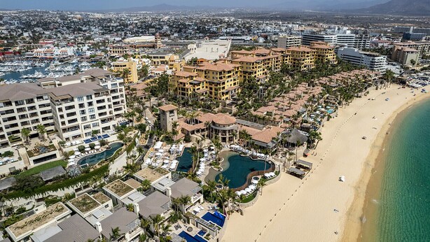 A coastal resort with multiple buildings, a beachfront, and a central pool area. - Hacienda Beach Club Oceanview 4BR home– Prime Cabo Location (Cabo San Lucas,)