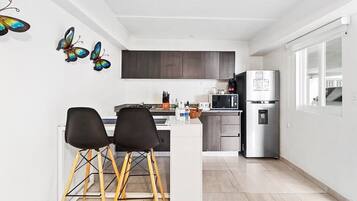 Fridge, microwave, stovetop, coffee/tea maker