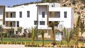 A modern multi-story hotel with a pool area in front. - Residence Tamourrit Taghazout Bay 4747 (Taghazout)
