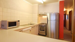 Lawlers Apartment | Private kitchen | Full-size fridge, microwave, oven, stovetop - Lawlers 43 (Hotham Heights)