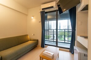 Superior Family Room, Non Smoking | Living area | Flat-screen TV