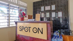 A reception desk labeled "SPOT ON" with a sign indicating reception is available. - Spot On 1847 Hotel Maya (Beru)