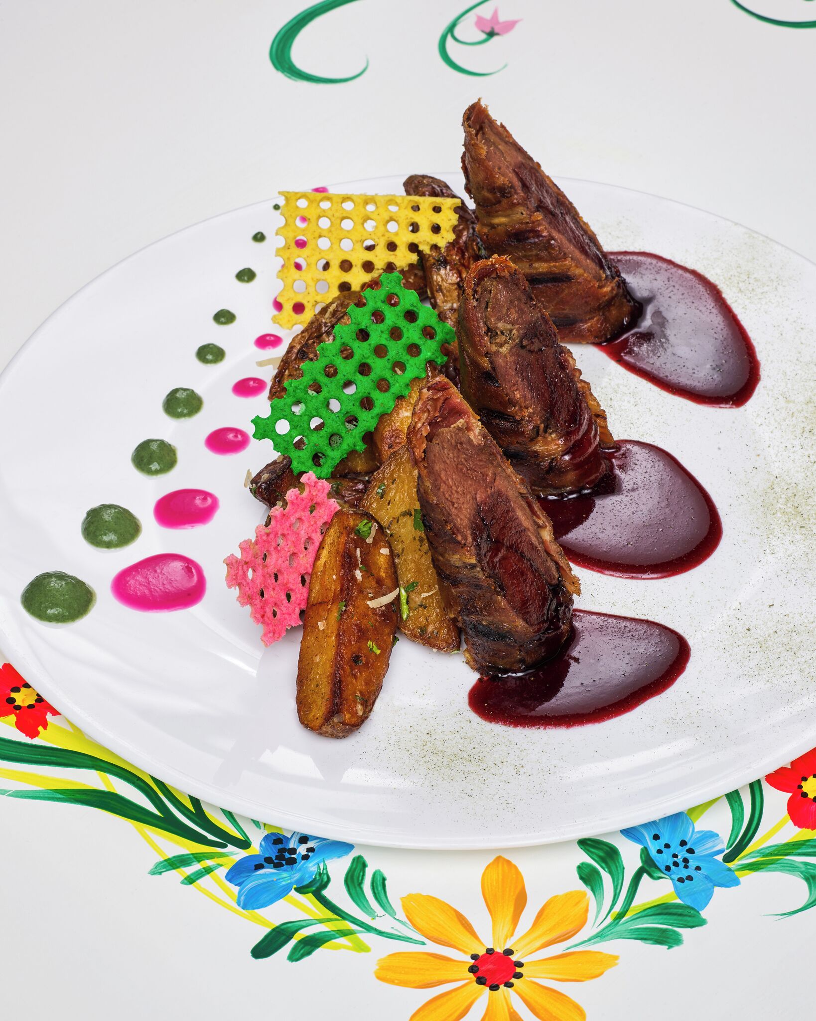 A plate of food with various sauces and garnishes.