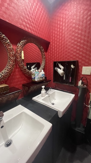 Separate bathtub and shower, designer toiletries, hair dryer, bathrobes