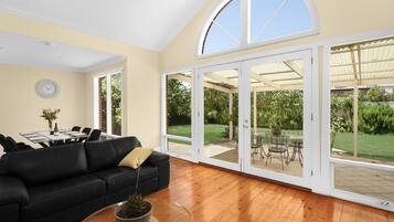 Premier House, 3 Bedrooms | Living area | Flat-screen TV, toys