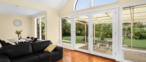 Premier House, 3 Bedrooms | Living area | Flat-screen TV, toys