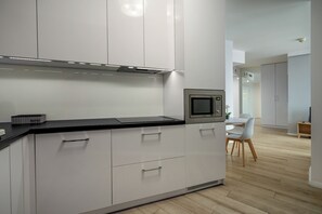 Comfort Apartment | Private kitchenette | Full-size fridge, stovetop, dishwasher, coffee/tea maker