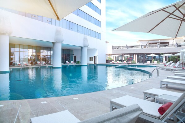 Outdoor pool, open 8:00 AM to 8:00 PM, pool umbrellas, pool loungers
