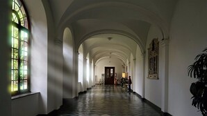 A long corridor with arched ceilings and a tiled floor. - Abdij Rolduc (Kerkrade)
