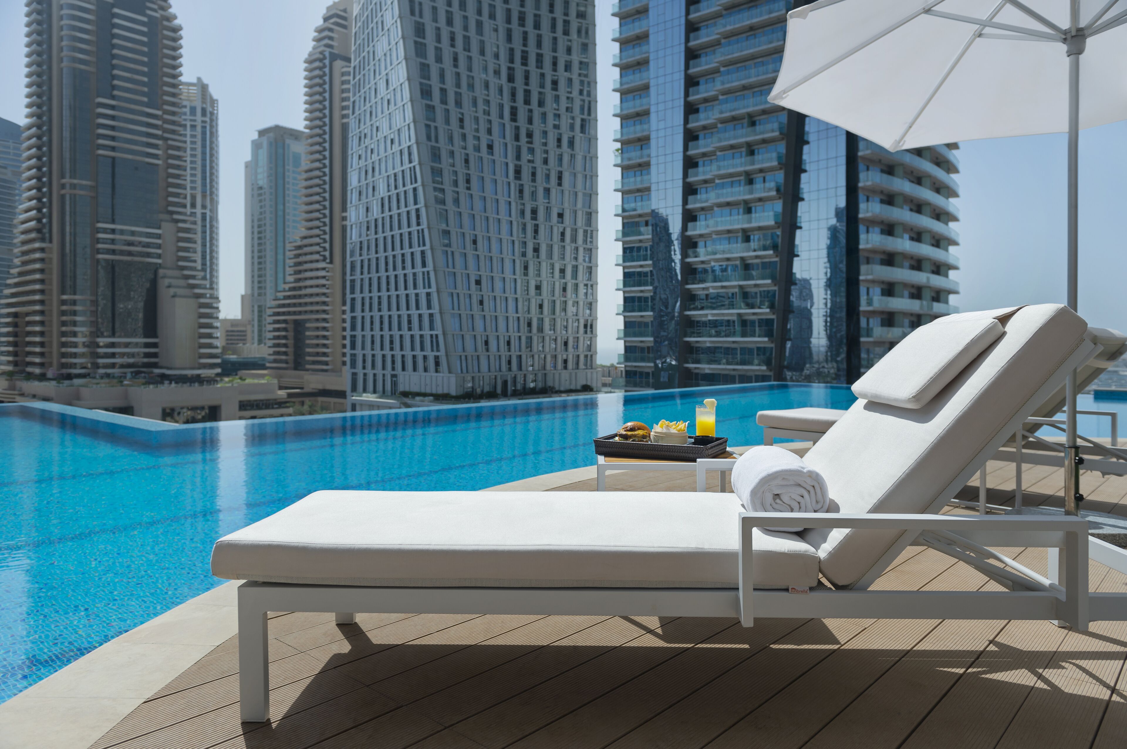 outdoor pool, pool umbrellas, pool loungers