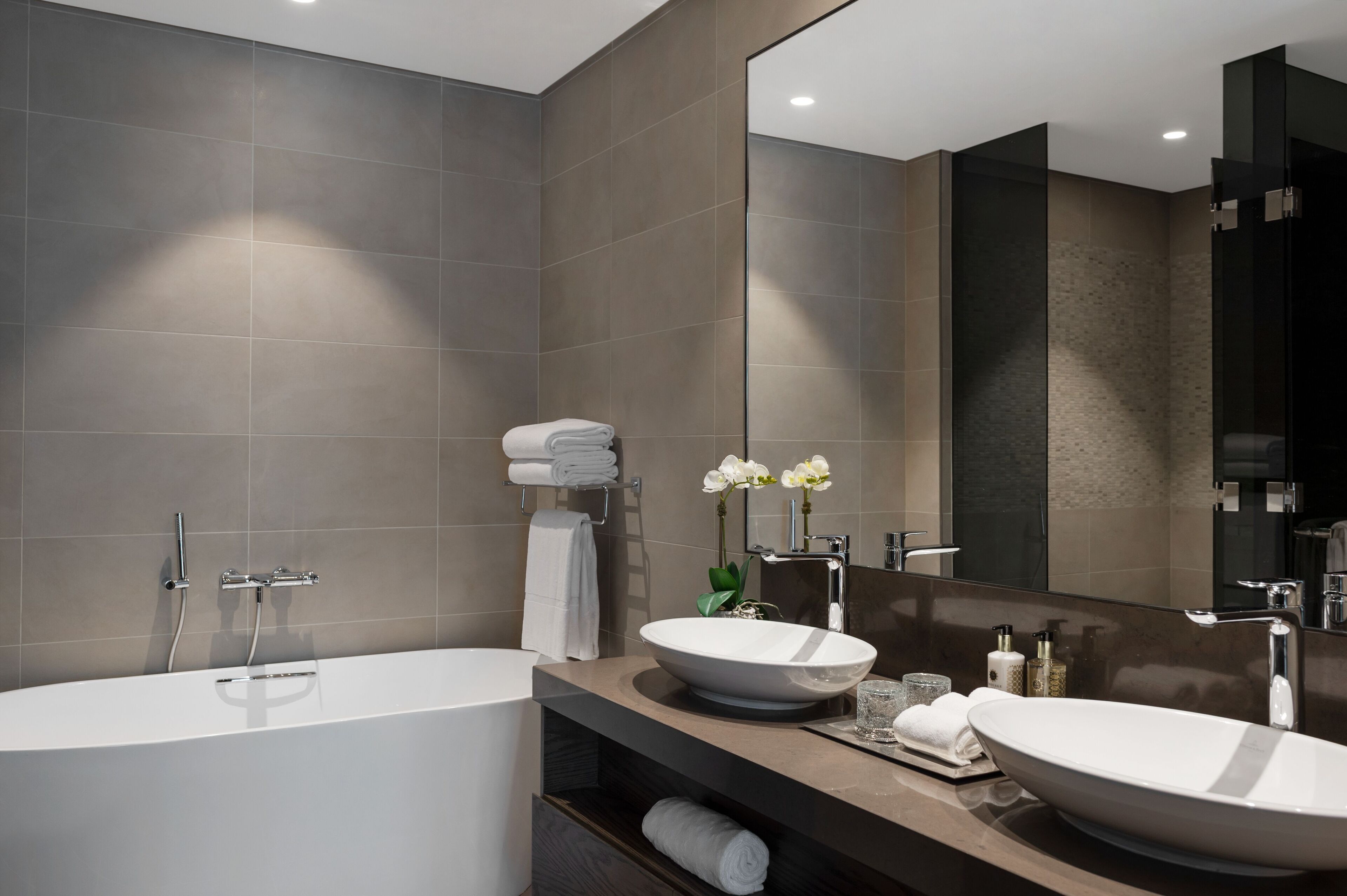 designer toiletries, hair dryer, bathrobes, slippers