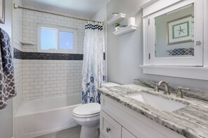 Combined shower/tub, hair dryer, towels - Gone Coastal by Beach Boutique Rentals (Holmes Beach)
