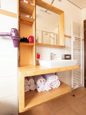 Bathtub, hair dryer, towels, soap