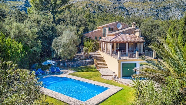 A villa with a swimming pool, surrounded by lush greenery and mountains. - TOMAS. Pretty and classical  villa close to Cala San Vicente (Cala San Vicente)