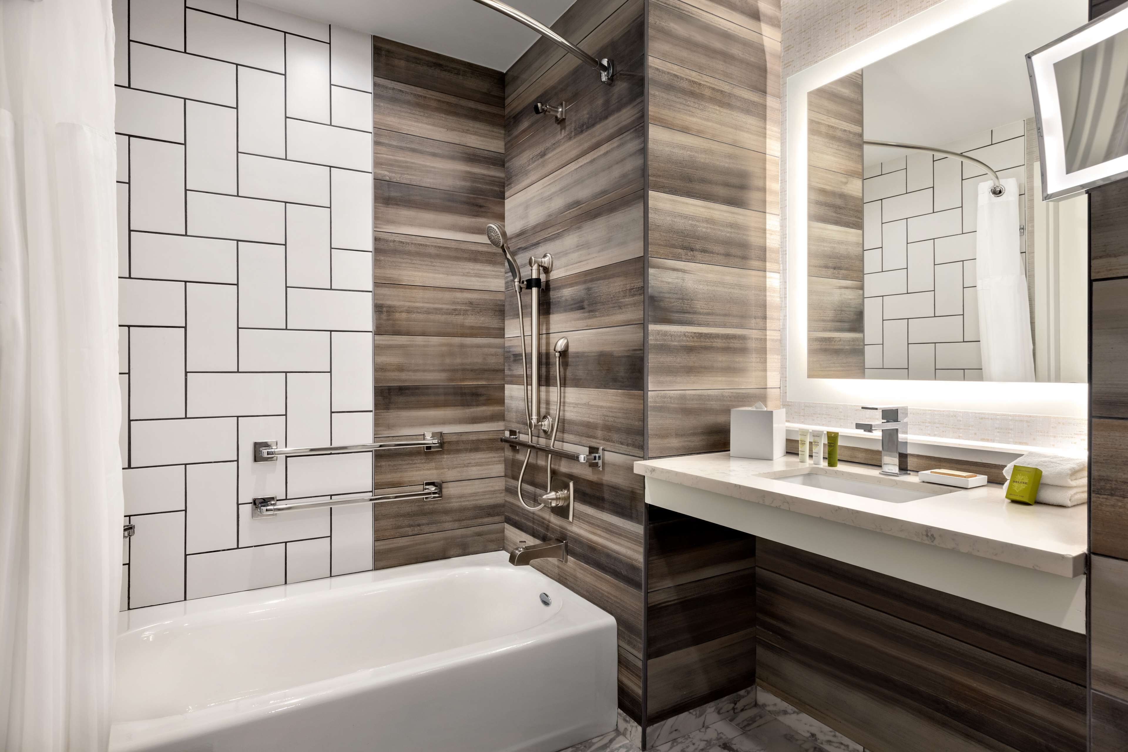 designer toiletries, hair dryer, towels, soap