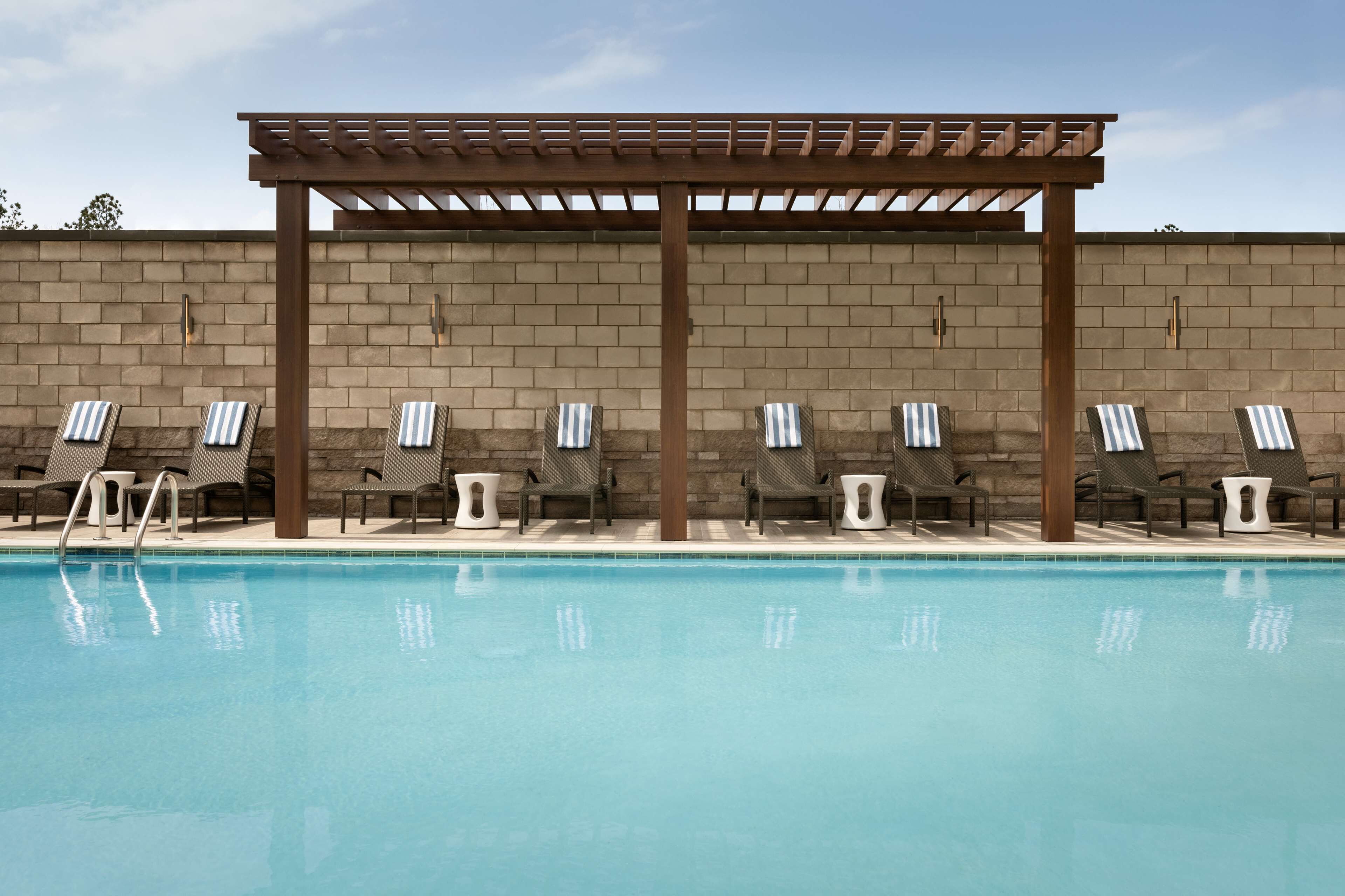 outdoor pool, open 7:00 am to 10:00 pm, pool umbrellas, pool loungers