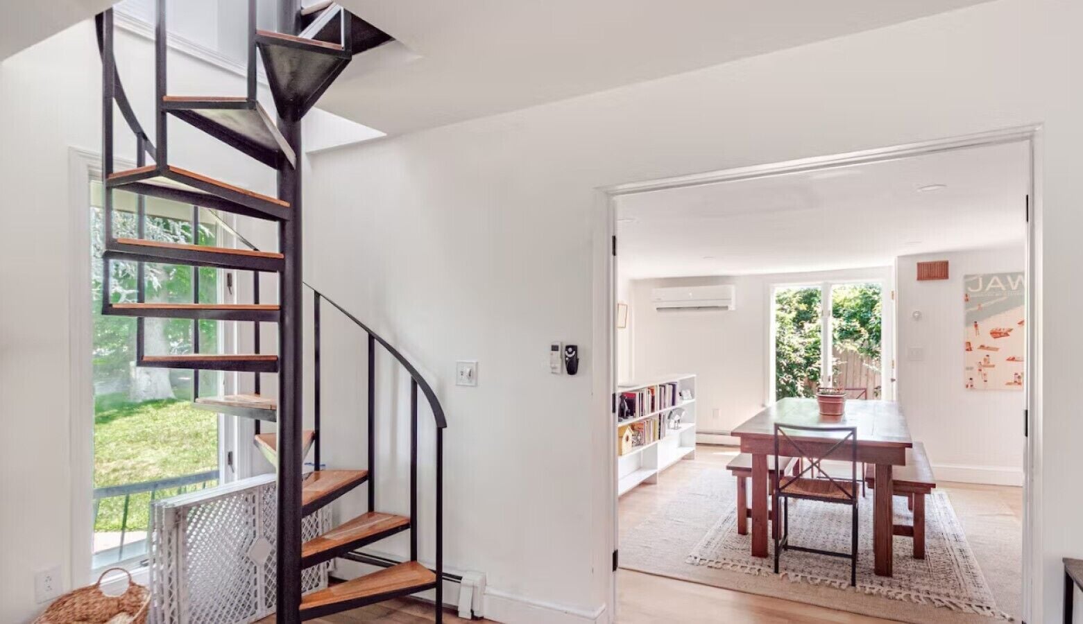 Living Room viewing Spiral Staircase and Dinning Room